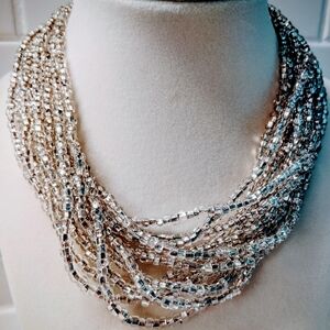 Silver-tone 12-Strand Sead Bead Necklace with Cascading Elegance